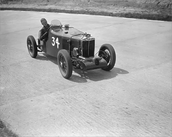 Miss D Stanley-Turner and her supercharged MG on the test hill hairpin during practice