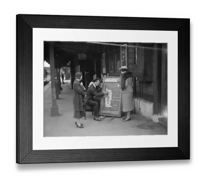 Framed Print : People gather round to watch the railway porter sign writer Mr E A Burgar. 1938 Framed Print : People gather round to watch the railway porter sign writer Mr E A Burgar. 1938