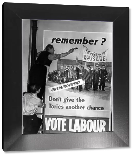 One of the Labour posters for the General Election campaign being put up at Transport House