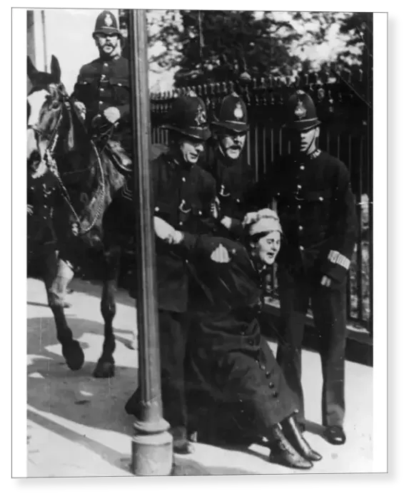 Print : Political - four policemen, one mounted, arrest a suffragette Print : Political - four policemen, one mounted, arrest a suffragette