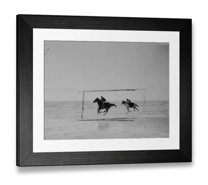 Framed Print : Race horses train on sands. Some of Britains leading racehorses, unable to train