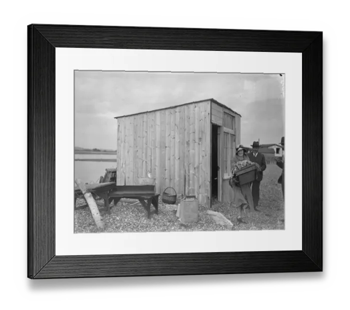 Framed Print : Sea defences broken by flood tide at Winchelsea, bungalows flooded and holidaymakers
