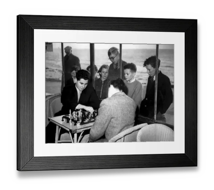 Framed Print : Hastings, Sussex: A group of youngsters watch through the window of the Sun Lounge Framed Print : Hastings, Sussex: A group of youngsters watch through the window of the Sun Lounge
