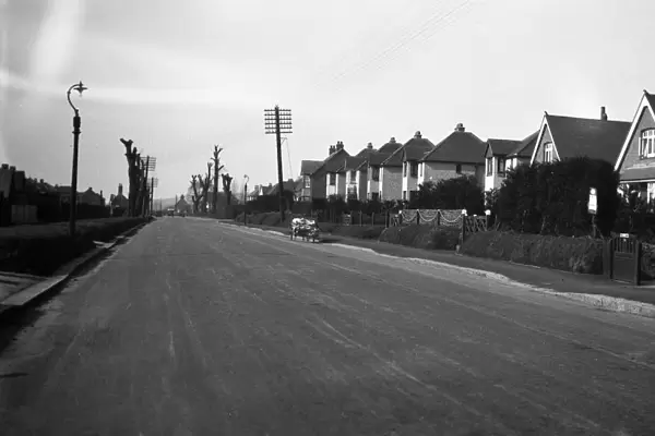 The road through West Tarring, near Worthing, Sussex. 7 March 1931