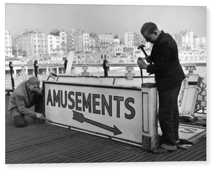 Print : Brighton Pier Signs, which have been in hibernation all through the drab winter are brought out Print : Brighton Pier Signs, which have been in hibernation all through the drab winter are brought out