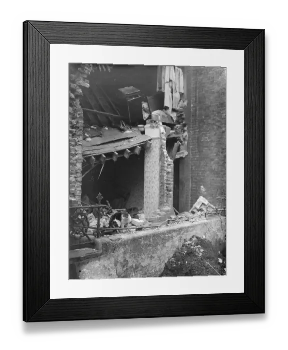 Framed Print : Survivor amid the ruins. London house wrecked by explosion. One man, John Clancy