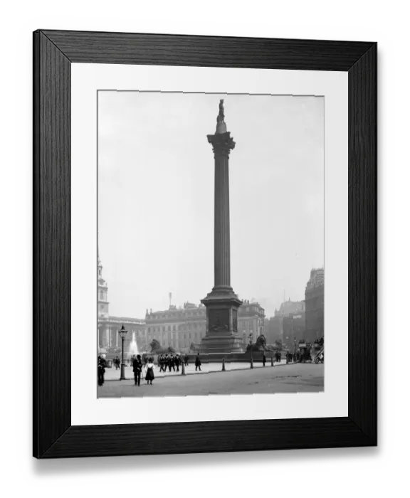 Framed Print : London street scene Nelsons Column in Trafalgar Square, London, England with Morley Framed Print : London street scene Nelsons Column in Trafalgar Square, London, England with Morley