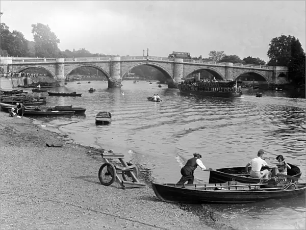 People out enjoying the river Thames at Richmond, London, hiring rowing boats
