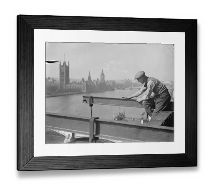Framed Print : He looks down on Parliament. A welder on a precarious perch high above the Albert Embankment Framed Print : He looks down on Parliament. A welder on a precarious perch high above the Albert Embankment