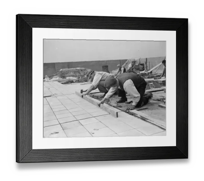 Framed Print : Workers from Val De Travers Asphalt Limited, a paving company, working on a roof in Greenwich Framed Print : Workers from Val De Travers Asphalt Limited, a paving company, working on a roof in Greenwich