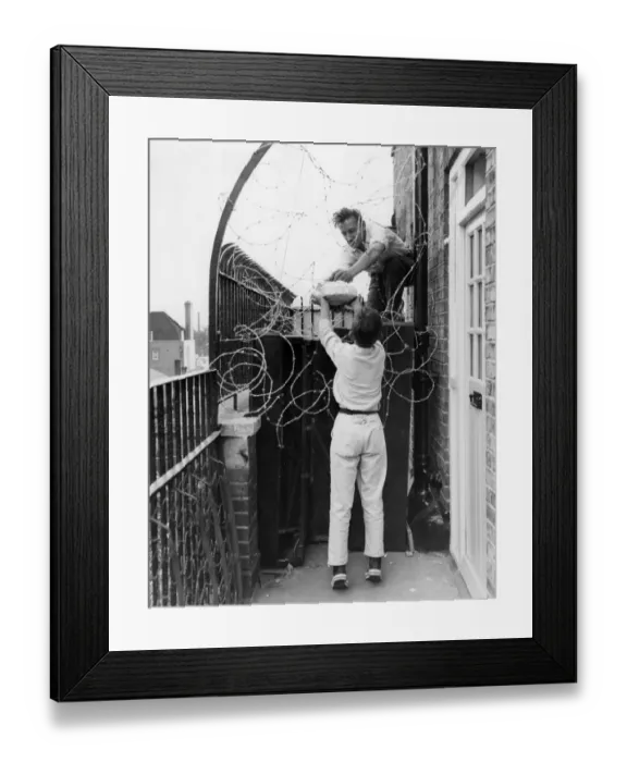 Framed Print : Mr. Donald Cook, Secretary of the St. Pancras United Tenants Association, takes some Framed Print : Mr. Donald Cook, Secretary of the St. Pancras United Tenants Association, takes some