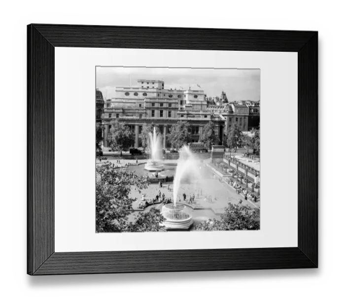 Framed Print : People enjoying the sunshine and the fountains in Trafalgar Square, London, England Framed Print : People enjoying the sunshine and the fountains in Trafalgar Square, London, England