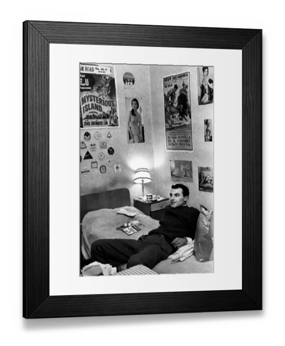 Framed Print : A colonial relaxes in his bed sitter in Earls Court London. This is a room in Nevern Rd Framed Print : A colonial relaxes in his bed sitter in Earls Court London. This is a room in Nevern Rd