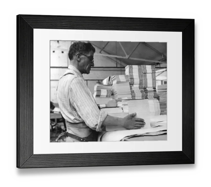 Framed Print : Sydney Payne packing for export. Like many of the Penguin Books staff, he has been Framed Print : Sydney Payne packing for export. Like many of the Penguin Books staff, he has been