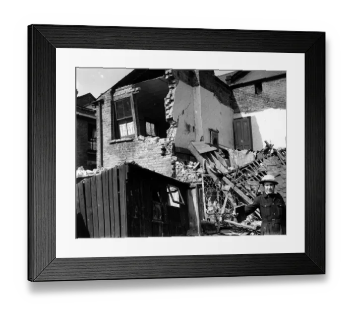 Framed Print : Home front 1940. Destroyed house lies dormant after German bombers had finished Framed Print : Home front 1940. Destroyed house lies dormant after German bombers had finished