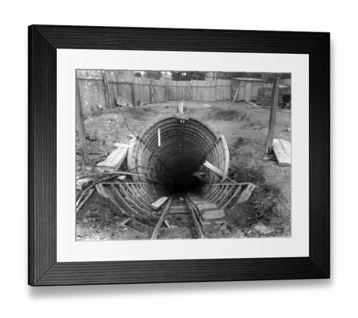 Framed Print : A pilot tunnel for the London Tube leading to the construction of an escalator tunnel