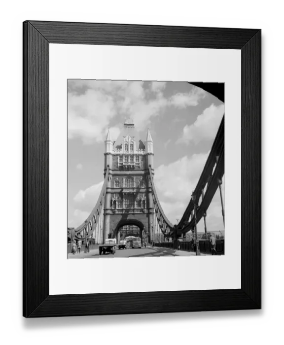 Framed Print : Vehicles and pedestians making their way across Tower Bridge over the River Thames