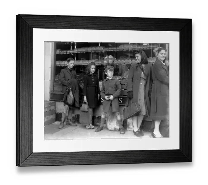 Framed Print : Bread rationing. Housewives and children queue at the bakers in Bexley Heath. 1946 Framed Print : Bread rationing. Housewives and children queue at the bakers in Bexley Heath. 1946