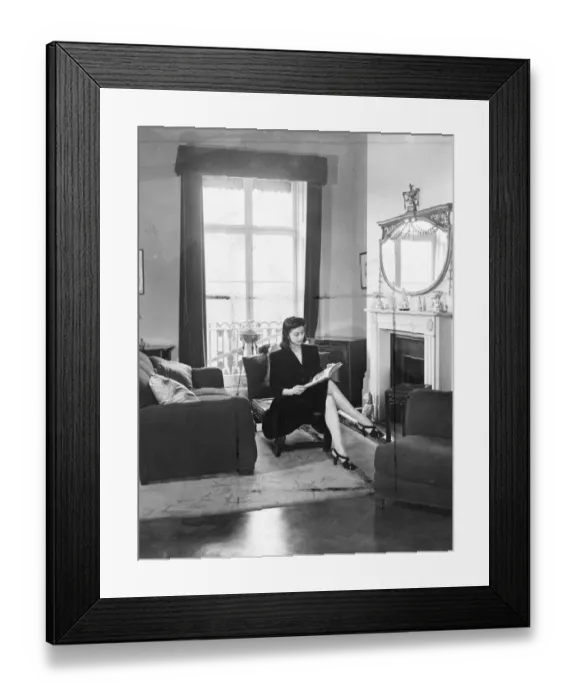 Framed Print : Margot Fonteyn at home. A quiet read by the fireside before leaving for the Royal Opera House