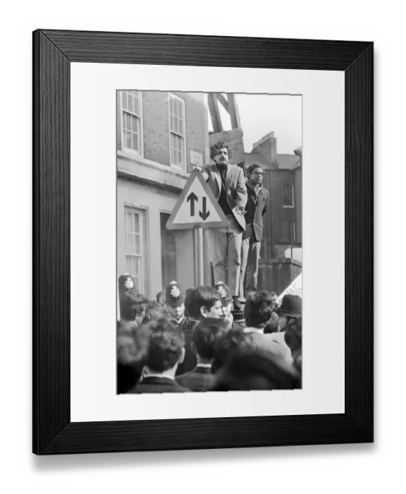 Framed Print : London: Pakistani-born student leader Tariq Ali stands a top pillar-box near