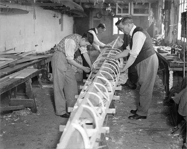 The Boat Race 1933 The Cambridge Boat under construction at Sims boathouse on 2