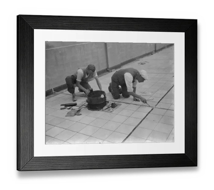 Framed Print : Workers from Val De Travers Asphalt Limited, a paving company, working on a roof in Greenwich Framed Print : Workers from Val De Travers Asphalt Limited, a paving company, working on a roof in Greenwich