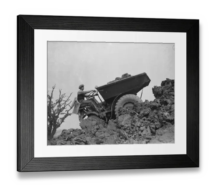 Framed Print : A mechanical navvy carrying away the spoil during the excavations on the site of