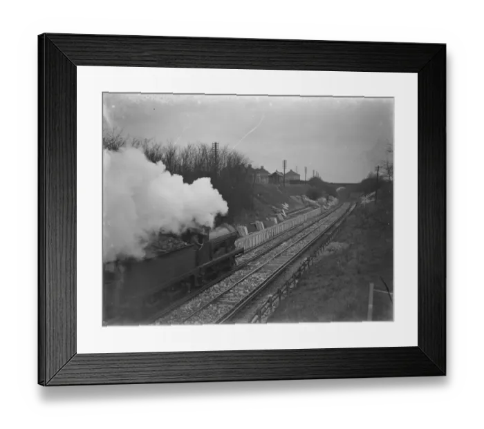 Framed Print : A train is going past the site where the Albany Park Train Station is under construction Framed Print : A train is going past the site where the Albany Park Train Station is under construction