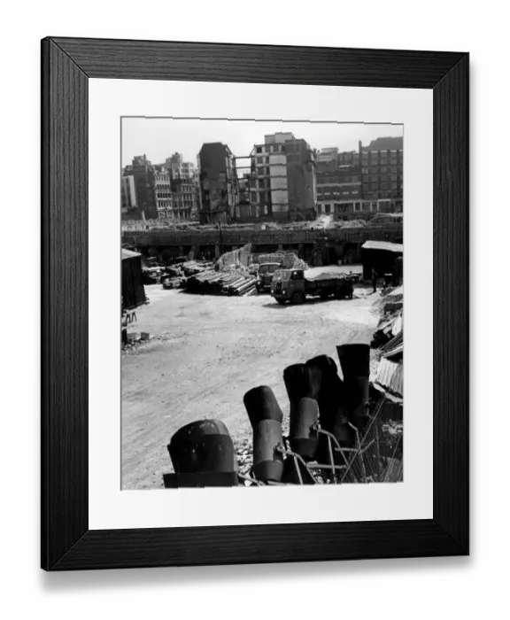 Framed Print : In the foreground are the relics of days when Londons life was torn by intence warfare-sandbags-fillers