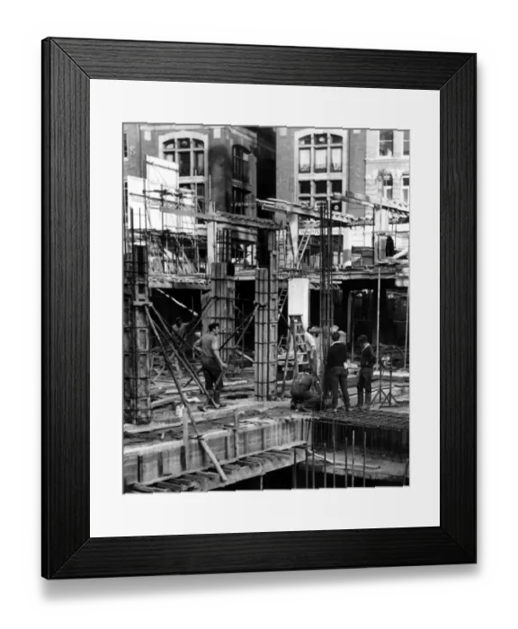 Framed Print : Construction workers working on a building site in central London, England Framed Print : Construction workers working on a building site in central London, England