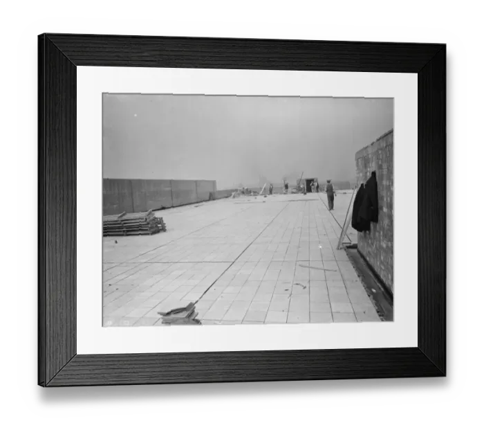 Framed Print : Workers from Val De Travers Asphalt Limited, a paving company, working on a roof in Greenwich Framed Print : Workers from Val De Travers Asphalt Limited, a paving company, working on a roof in Greenwich