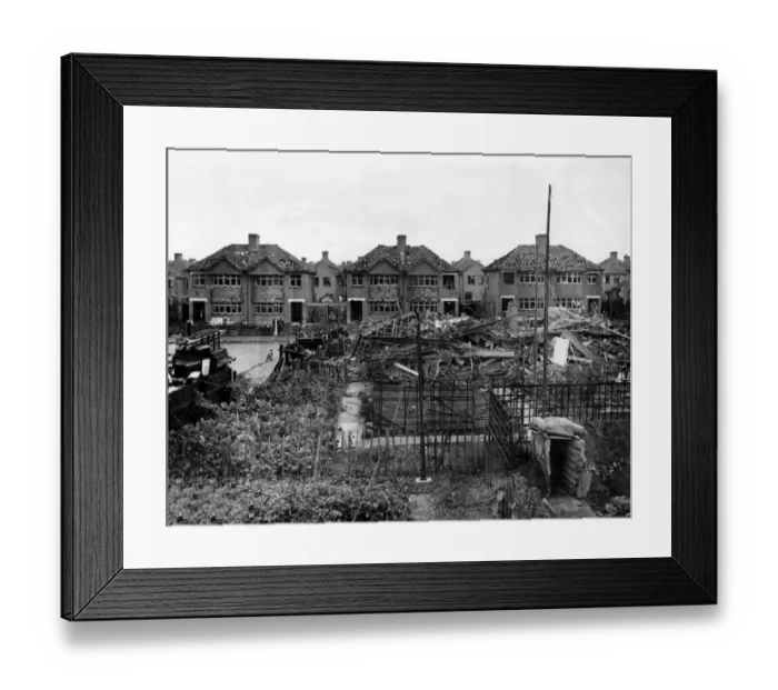 Framed Print : Home front 1940. A residential area showing signs of being heavily damaged after Framed Print : Home front 1940. A residential area showing signs of being heavily damaged after