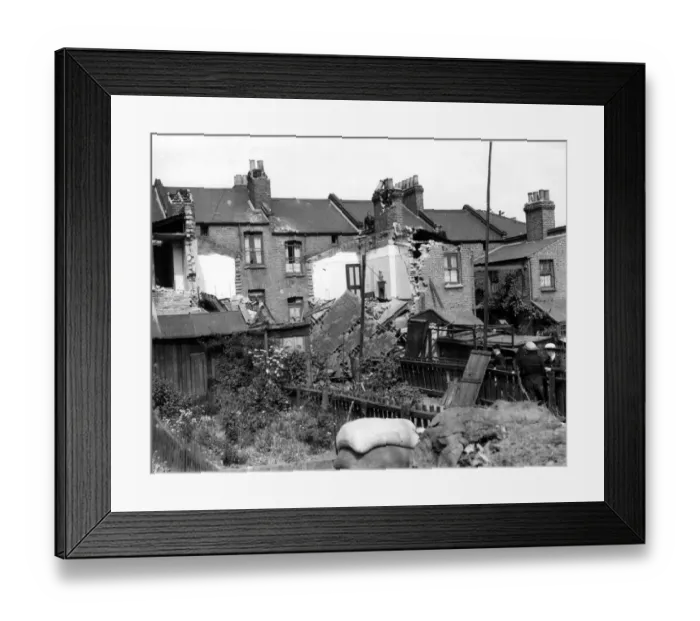 Framed Print : Home front 1940. A residential area showing signs of being heavily damaged after Framed Print : Home front 1940. A residential area showing signs of being heavily damaged after