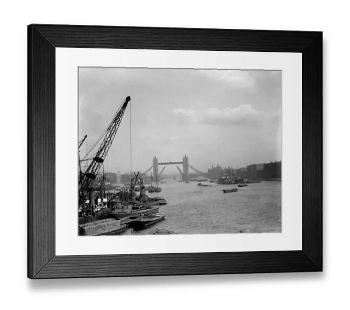 Framed Print : London. River Thames with barges, boats and crane with the Tower Bridge in Framed Print : London. River Thames with barges, boats and crane with the Tower Bridge in