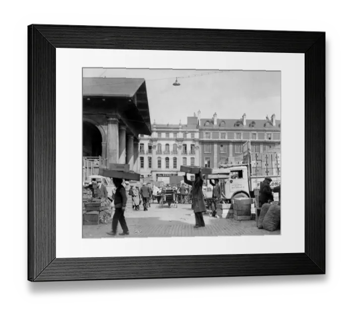 Framed Print : Busy market porters carrying boxes on their heads at Covent Gardens flower, fruit