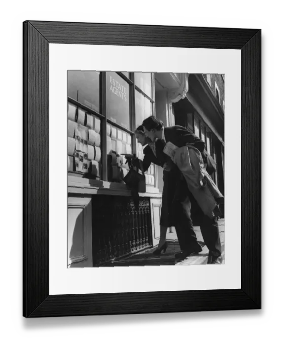 Framed Print : Couple lookng at houses in the window of an estate agent - 1950 ?TopFoto Framed Print : Couple lookng at houses in the window of an estate agent - 1950 ?TopFoto