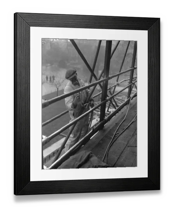 Framed Print : Coronation spray by masked workmen. A workman wearing a special mask as he sprays Framed Print : Coronation spray by masked workmen. A workman wearing a special mask as he sprays
