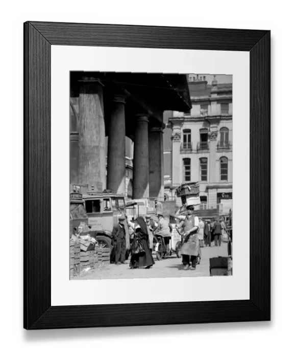 Framed Print : A nun picks her way through the busy flower, fruit and vegetable market, past all Framed Print : A nun picks her way through the busy flower, fruit and vegetable market, past all