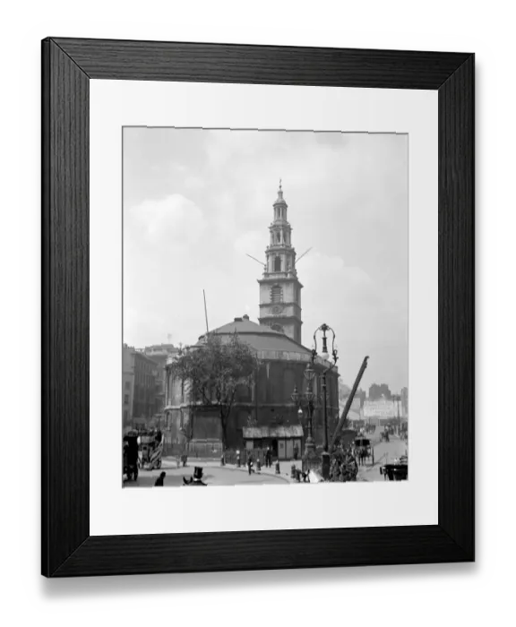 Framed Print : London streetscene. The back view of St Clement Danes Church, The Strand, London