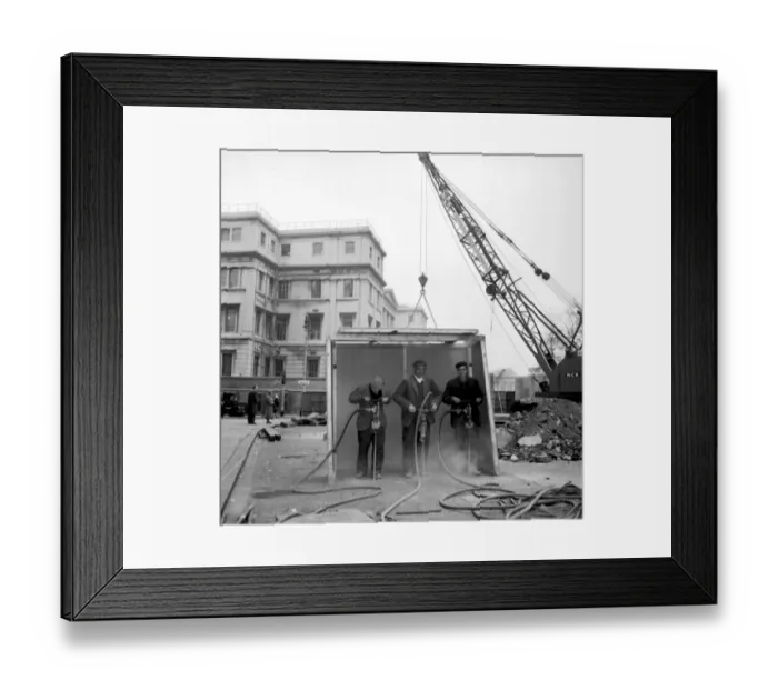 Framed Print : A purpose built shelter to protect from sound. Workmen break up the road surface outside St Framed Print : A purpose built shelter to protect from sound. Workmen break up the road surface outside St