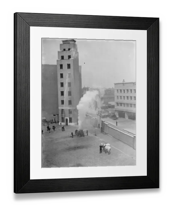 Framed Print : A London Fire Brigade display in Lambeth, London. Fire crew use a steam-powered Framed Print : A London Fire Brigade display in Lambeth, London. Fire crew use a steam-powered
