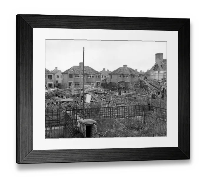 Framed Print : Home front 1940. A residential area showing signs of being heavily damaged after Framed Print : Home front 1940. A residential area showing signs of being heavily damaged after