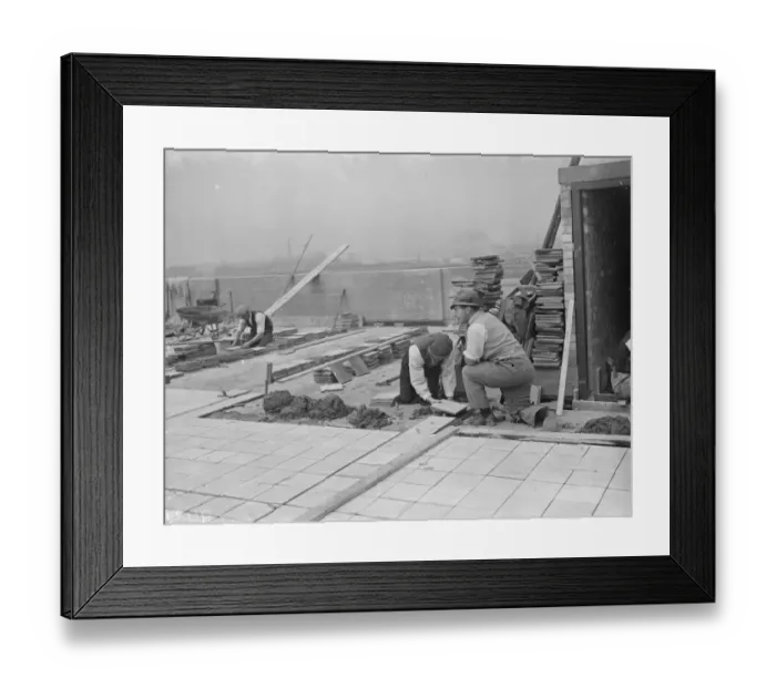 Framed Print : Workers from Val De Travers Asphalt Limited, a paving company, working on a roof in Greenwich Framed Print : Workers from Val De Travers Asphalt Limited, a paving company, working on a roof in Greenwich