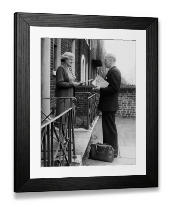 Framed Print : An enumerator seen collecting Census papers when on his rounds in Kennington, London