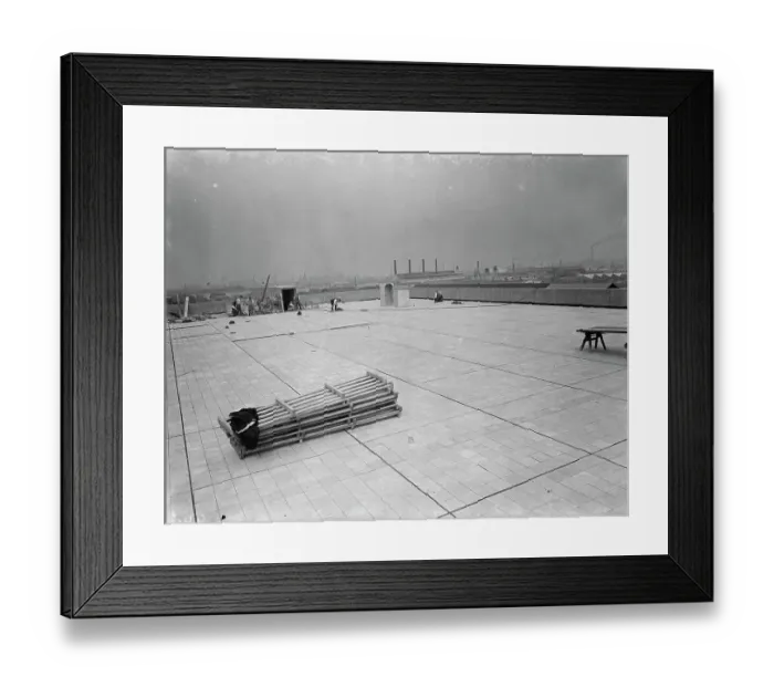 Framed Print : Workers from Val De Travers Asphalt Limited, a paving company, working on a roof in Greenwich Framed Print : Workers from Val De Travers Asphalt Limited, a paving company, working on a roof in Greenwich