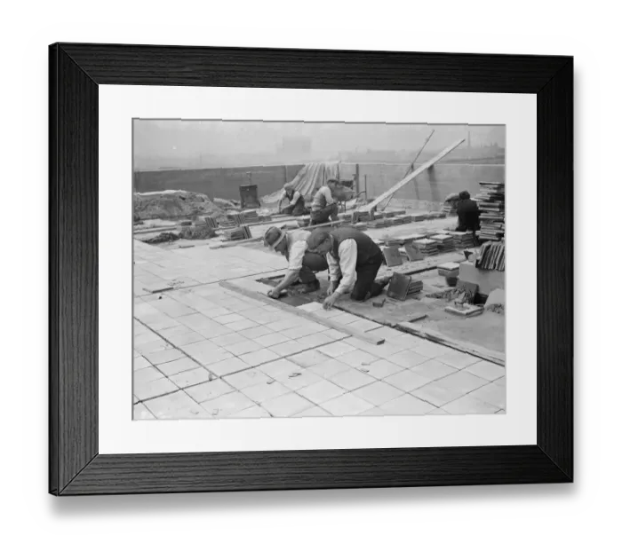 Framed Print : Workers from Val De Travers Asphalt Limited, a paving company, working on a roof in Greenwich Framed Print : Workers from Val De Travers Asphalt Limited, a paving company, working on a roof in Greenwich