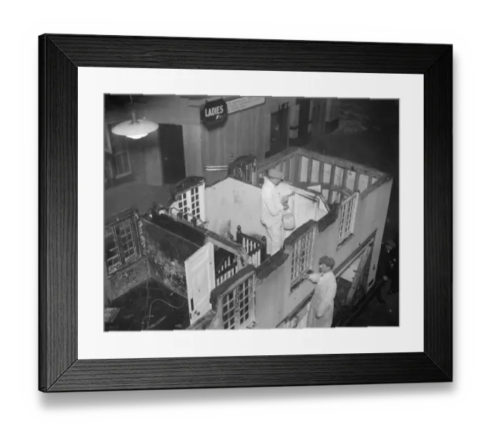 Framed Print : Repairing Princess Elizabeths model house at the Olympia. Immediately on arrival