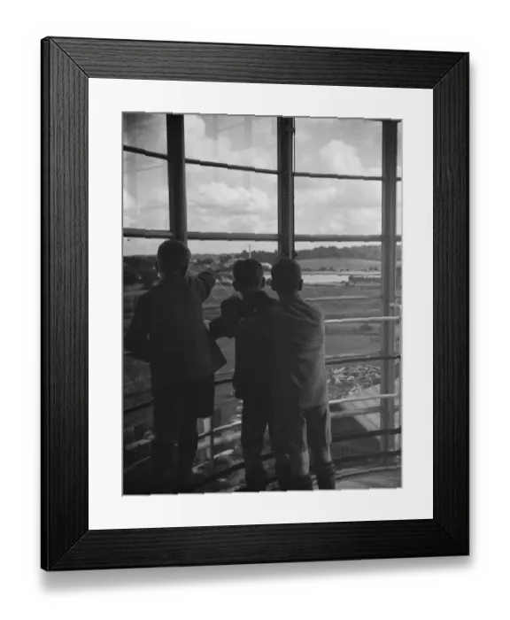 Framed Print : The County School for Boys in Sidcup, London. A group of boys are lookin through Framed Print : The County School for Boys in Sidcup, London. A group of boys are lookin through