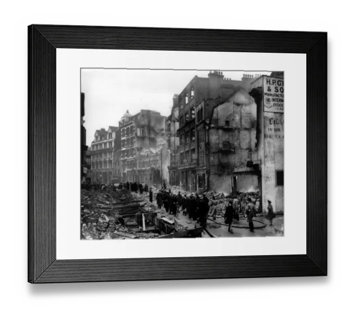 Framed Print : Home front 1940. Showing the destruction caused by German bombing, Brits go about Framed Print : Home front 1940. Showing the destruction caused by German bombing, Brits go about