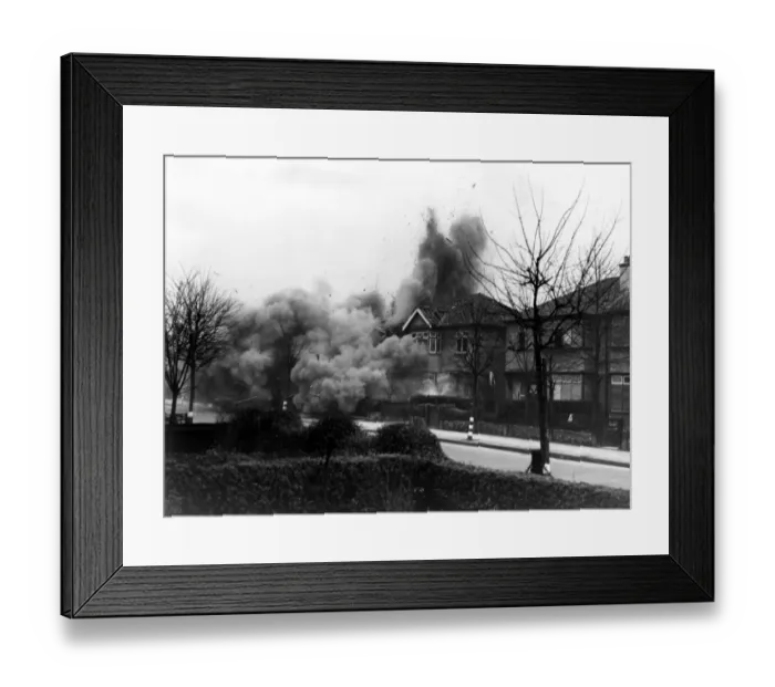 Framed Print : Smoke and debris thrown skywards after a direct hit from a German bomb in the suburbs Framed Print : Smoke and debris thrown skywards after a direct hit from a German bomb in the suburbs
